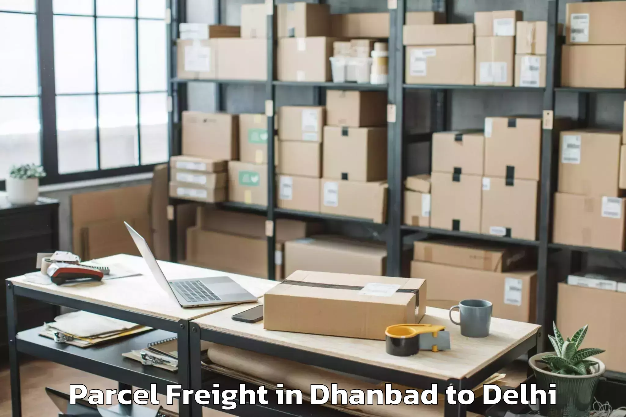 Book Dhanbad to Jamia Millia Islamia New Delhi Parcel Freight